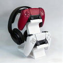 black 3-in-1 PS5 and Xbox Controller Stand – Compatible with PlayStation 5/Xbox Consoles. A gaming desktop organizer with a headphone hanger, non-charging base that holds 2 controllers and headphones. Space-saving white/black console accessory.