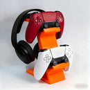 black 3-in-1 PS5 and Xbox Controller Stand – Compatible with PlayStation 5/Xbox Consoles. A gaming desktop organizer with a headphone hanger, non-charging base that holds 2 controllers and headphones. Space-saving white/black console accessory.