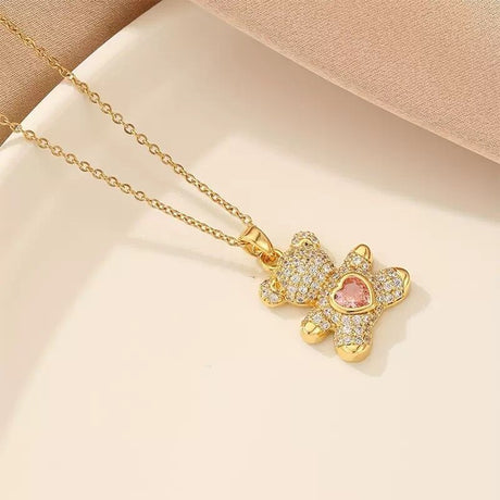 A delicate and adorable pink heart-shaped bear pendant copper necklace, adorned with synthetic zirconia, paired with a stainless steel chain, decorated with synthetic zirconia, perfect as a daily jewelry gift or a sweet and cute party accessory.（gold））