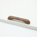Furniture handles - Kitchen handles - Door handles - Cabinet handles - Drawer knobs - Furniture fittings - Kitchen fittings - Handles - Walnut - Wood - Wooden - Kitchen renovation - Modern - Black walnut - Bridge shape - Pitch 128mm - Walnut - Set of 4