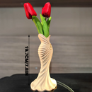 This elegant dress vase combines high-fashion elegance with minimalist home décor. Whether you insert real flowers into the glass tube or display artificial flowers without the tube, it is exceptionally beautiful.