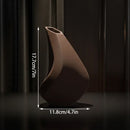 3D-printed sculpture of a contemplative vase,black