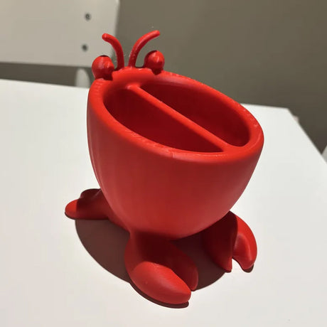 3D-printed crab-shaped toiletries storage box, red.