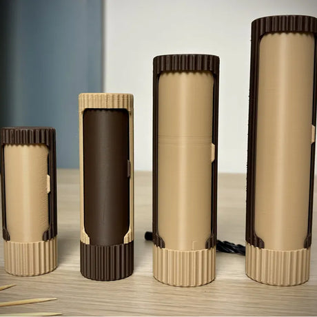 Compact 3D-printed rotating organizer capsule, 1.3 inches long x 4.1 inches high.