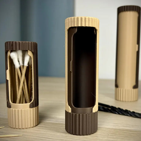 3D-printed compact rotating organizer capsule, 1.3 inches long x 5.9 inches high.