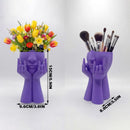 3D-printed rock face vase or office organizer, black.