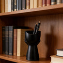 3D-printed rock face vase or office organizer, black.
