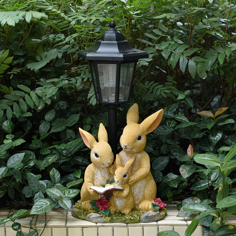 Solar Simulation Rabbit Ornament, charges by day and lights up automatically at night, three rabbits cluster around a street lamp with 