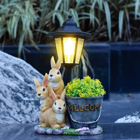 Solar Simulation Rabbit Ornament, charges by day and lights up automatically at night, three rabbits cluster around a street lamp with 