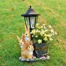 Solar Simulation Rabbit Ornament, charges by day and lights up automatically at night, three rabbits cluster around a street lamp with "WELCOME" bucket, warmly decorates courtyard and balcony, eco-friendly and healing./Rabbit's Kin