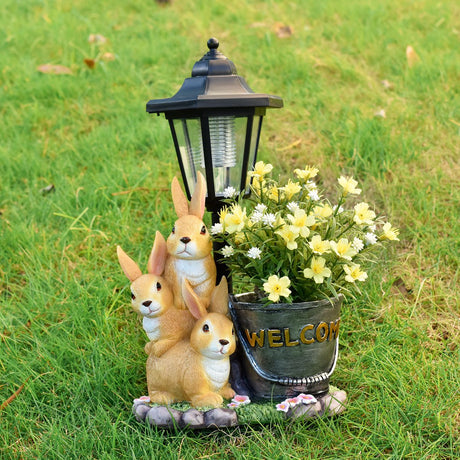 Solar Simulation Rabbit Ornament, charges by day and lights up automatically at night, three rabbits cluster around a street lamp with 