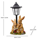 Solar Simulation Rabbit Ornament, charges by day and lights up automatically at night, three rabbits cluster around a street lamp with "WELCOME" bucket, warmly decorates courtyard and balcony, eco-friendly and healing./Rabbit's Kin