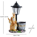 Solar Simulation Rabbit Ornament, charges by day and lights up automatically at night, three rabbits cluster around a street lamp with "WELCOME" bucket, warmly decorates courtyard and balcony, eco-friendly and healing./Rabbit's Kin