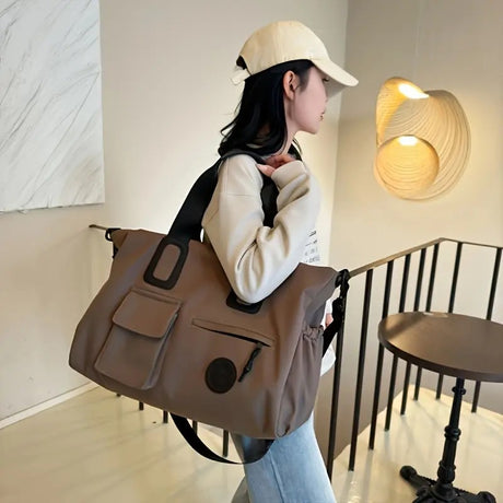 White Large-capacity travel tote bag, lightweight carry-on luggage with shoulder strap, gym bag, portable laptop bag, ideal for short trips, hand-carry style.