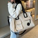 brown Large-capacity travel tote bag, lightweight carry-on luggage with shoulder strap, gym bag, portable laptop bag, ideal for short trips, hand-carry style.