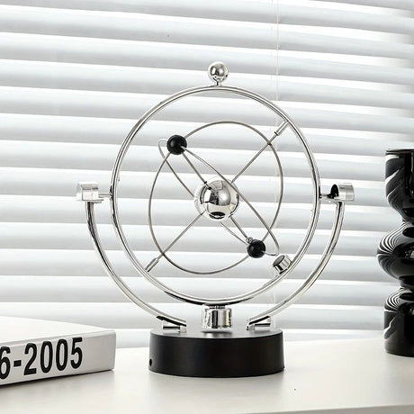 Newton's Cradle, an artistic craft piece for both home and office – a perpetual motion desktop ornament (requires 4 AA batteries to operate / batteries not included).