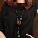 Bohemian style long necklace featuring retro beads and metal carved flowers with elegant dangling tassels adjustable 86cm chain suitable for pairing with sweaters and dresses perfect for daily wear or holiday occasions