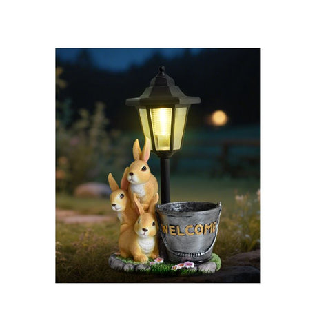 Solar Simulation Rabbit Ornament, charges by day and lights up automatically at night, three rabbits cluster around a street lamp with 