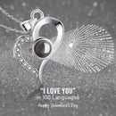 Rose Heart Projection Necklace, elegant in platinum, "I love you" in 100 languages, packaged with a single rose gift box – a romantic tech-infused gift.