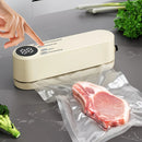 beige.USB Rechargeable Portable Vacuum Sealer, includes sealing bags and a rapid vacuum pump. Space-saving design, suitable for vacuum packing snacks, meat, fruits, and vegetables for food preservation.