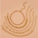 A golden five-piece set Chic Multi-Layered Alloy Bracelet Set - Fashionable Stackable Jewelry