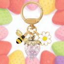 Crystal Pink Strawberry Bee Daisy Keychain - Gold Metal Ring with Rhinestone Fruit Charm, Cute Bag Accessory for Women and Girls