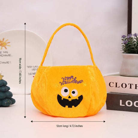 Yellow bag with a pumpkin pattern - Plush Halloween Trick or Treat Candy Bag - Polyester  Tote with Embroidered Face, Lightweight Portable Goody Pouch for  Party Favors and Trick or Treating